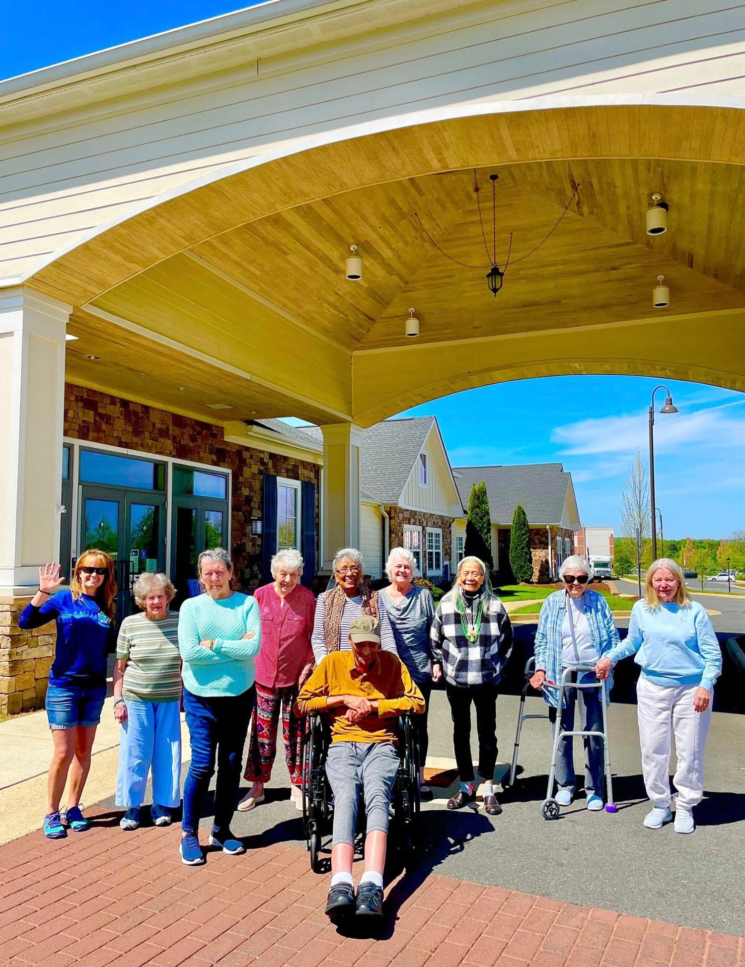 Senior residents standing in front of the community