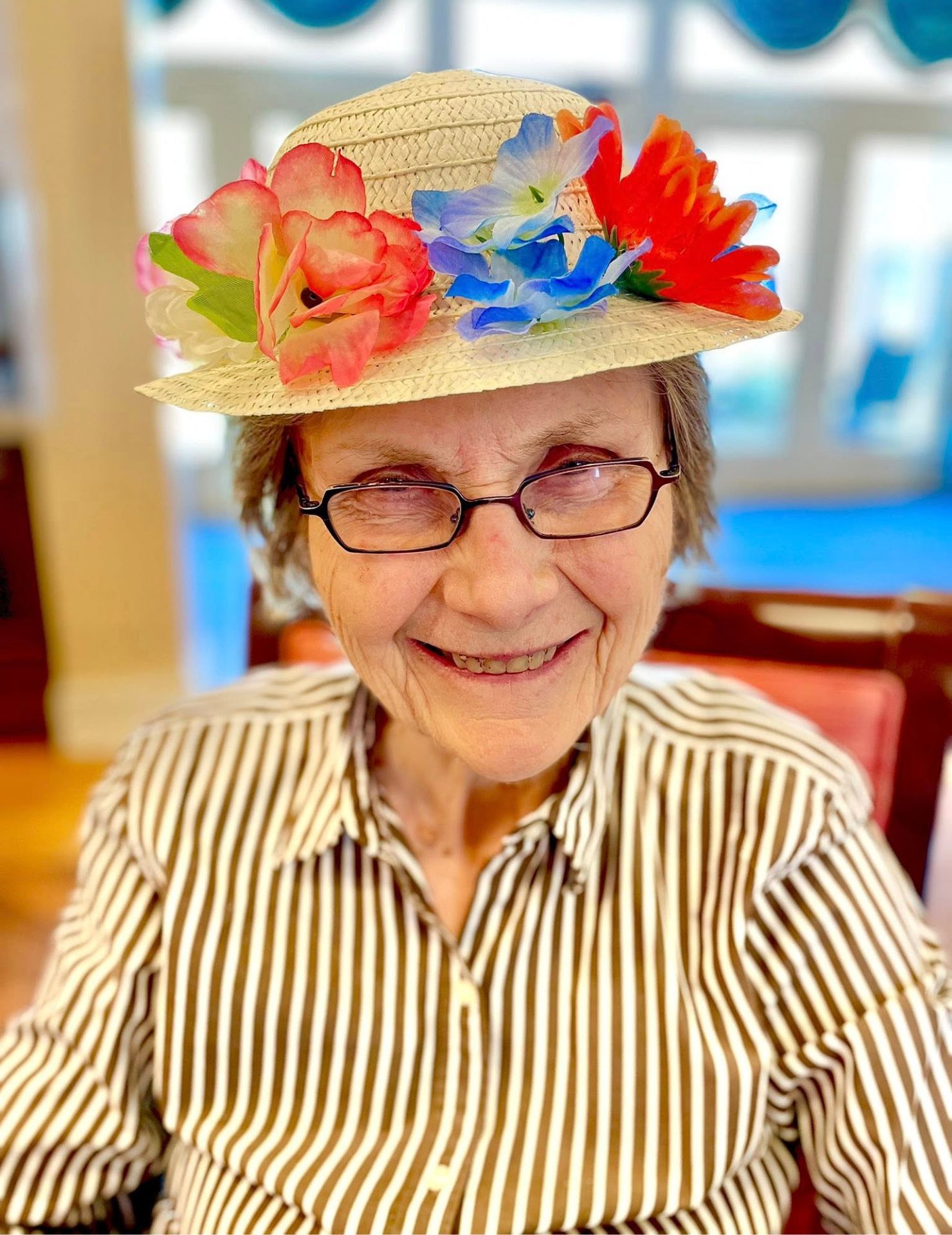 Senior resident wearing a flower hat
